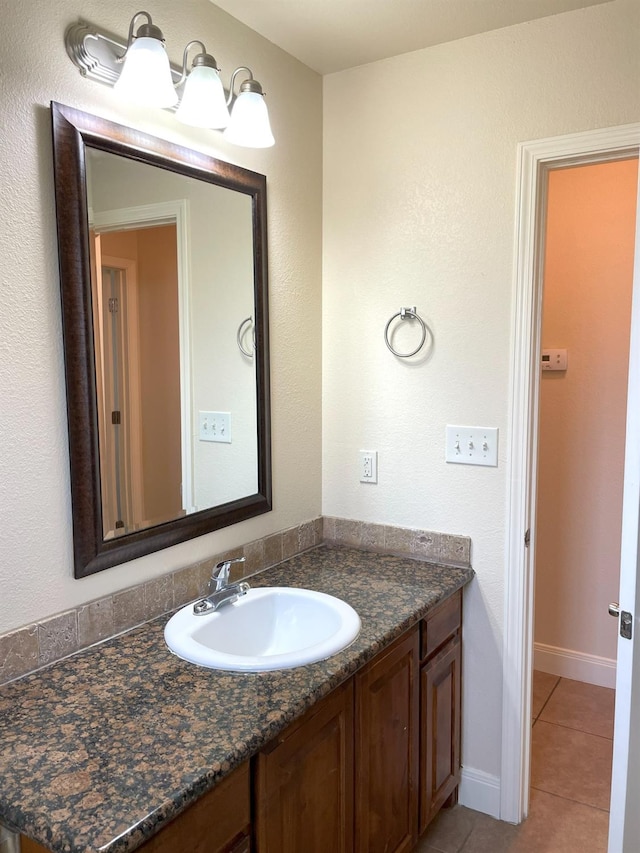 bathroom with tile patterned floors and vanity