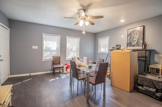 dining space featuring dark hardwood / wood-style floors and ceiling fan