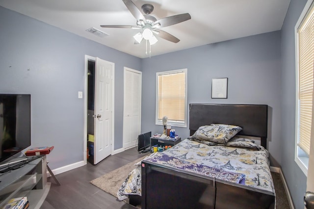 bedroom featuring dark wood-type flooring and ceiling fan