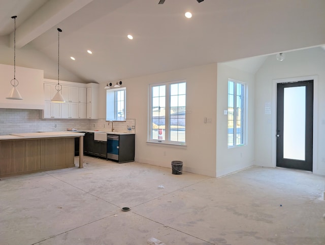 kitchen featuring vaulted ceiling with beams, white cabinets, decorative backsplash, and light countertops