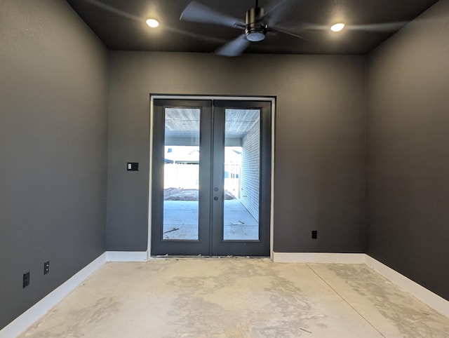 interior space with concrete flooring, french doors, baseboards, and a ceiling fan