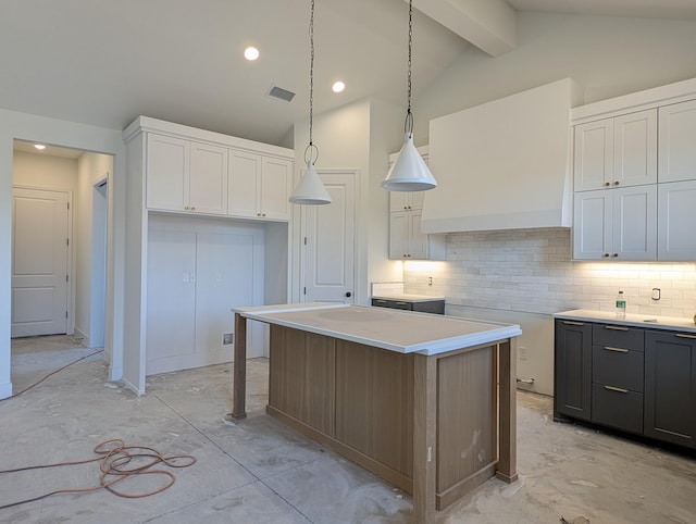 kitchen with backsplash, visible vents, and white cabinetry