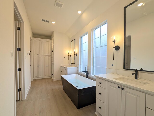 interior space with visible vents and tiled shower