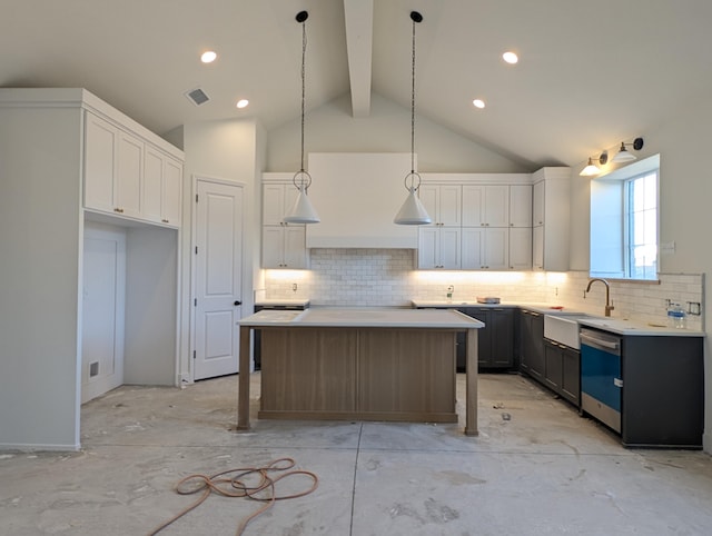 kitchen with dishwashing machine, a kitchen island, visible vents, white cabinetry, and beamed ceiling