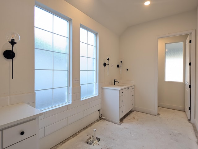 bathroom featuring a sink and baseboards