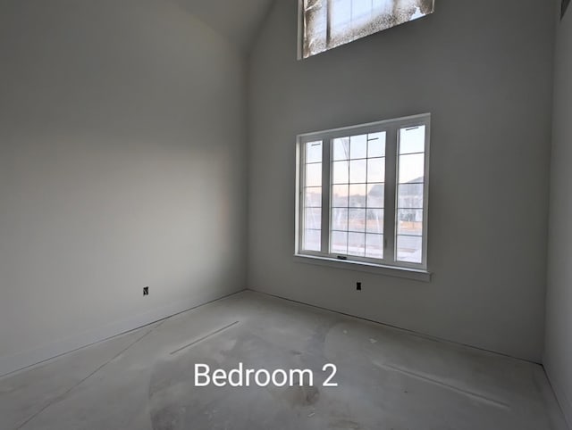 empty room with concrete flooring