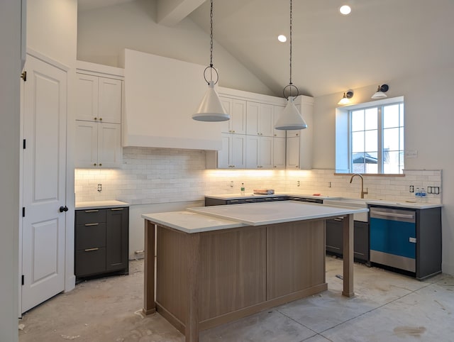 kitchen with lofted ceiling with beams, dishwashing machine, tasteful backsplash, and white cabinets