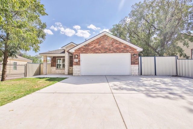 view of front of home with a garage and a front yard