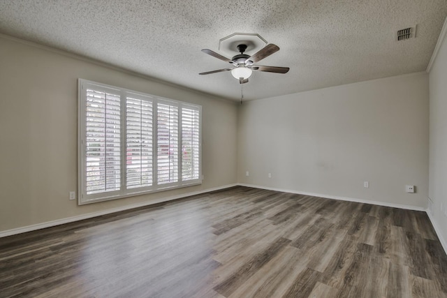 unfurnished room featuring ceiling fan, dark wood-type flooring, and a textured ceiling