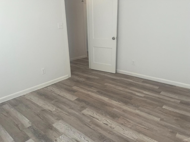 empty room with wood-type flooring