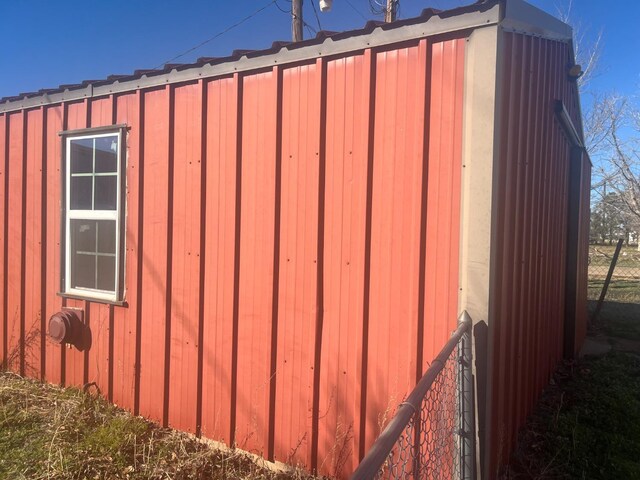 view of side of home with an outbuilding