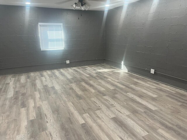 empty room featuring ceiling fan and wood-type flooring