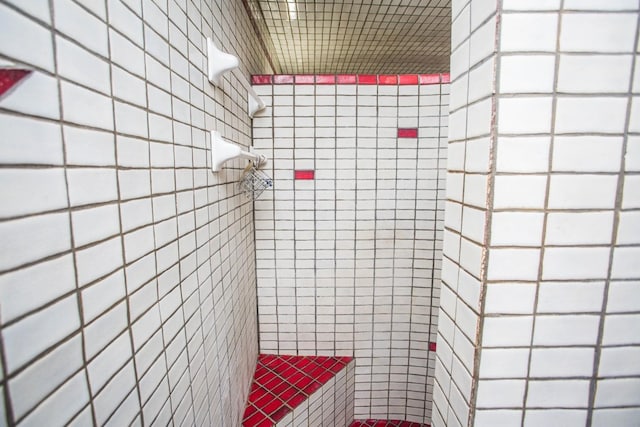 bathroom with a tile shower