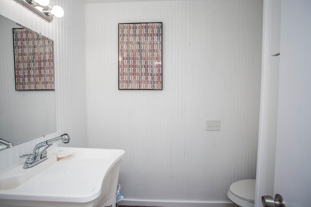 bathroom featuring sink and toilet