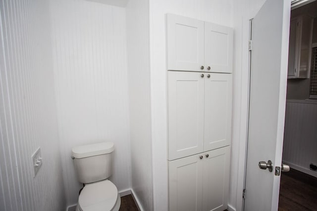 bathroom with wood-type flooring and toilet