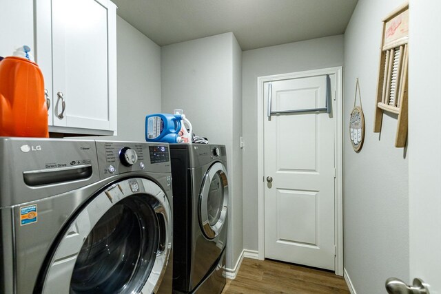 2541 137th St, Lubbock, TX 79423 - washroom featuring cabinets, washing machine and dryer, and light hardwood / wood-style floors