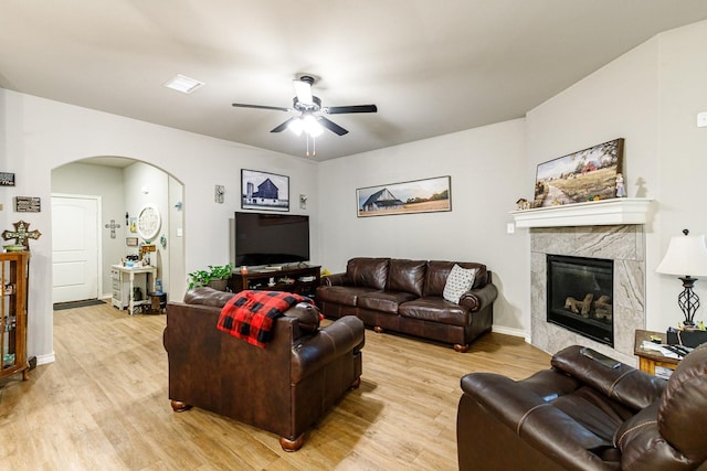 2541 137th St, Lubbock, TX 79423 - living room with ceiling fan, a fireplace, and light wood-type flooring
