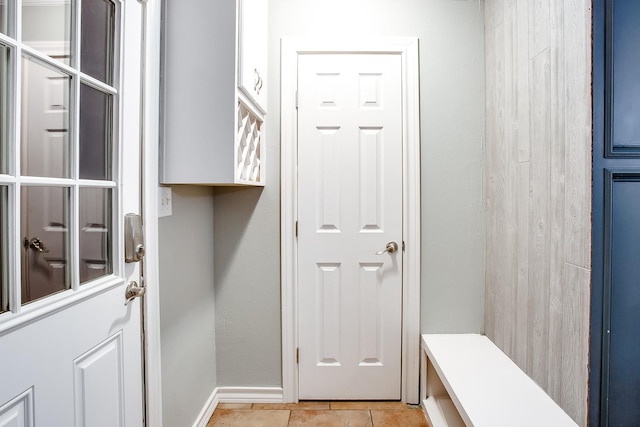 mudroom featuring light tile patterned flooring