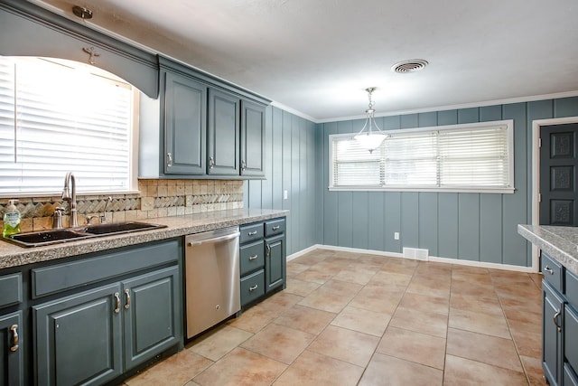 kitchen featuring pendant lighting, sink, light tile patterned floors, dishwasher, and a healthy amount of sunlight