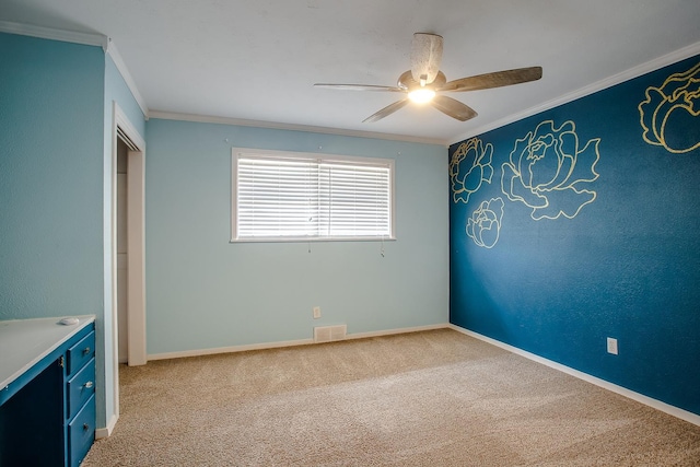 interior space with crown molding and ceiling fan