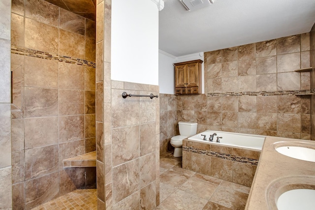 full bathroom with vanity, toilet, tile walls, and shower with separate bathtub