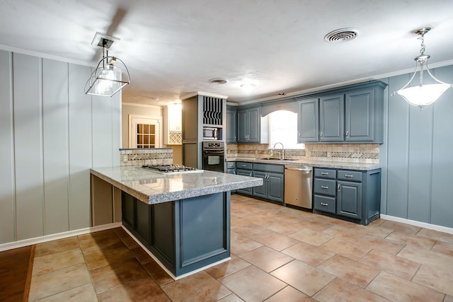 kitchen with hanging light fixtures, crown molding, appliances with stainless steel finishes, and kitchen peninsula