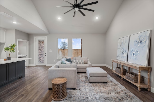 living area featuring baseboards, visible vents, dark wood-style flooring, and recessed lighting