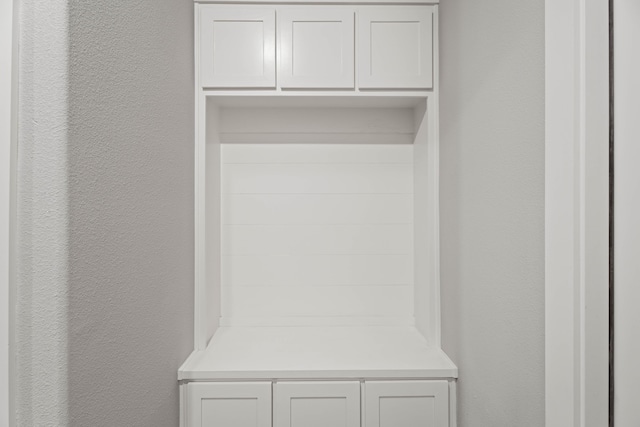 mudroom with a textured wall