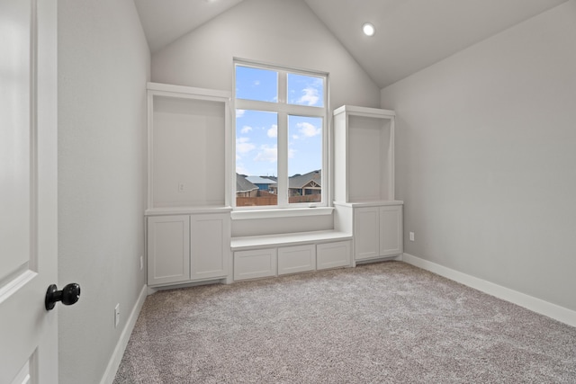 additional living space with light carpet, high vaulted ceiling, recessed lighting, and baseboards