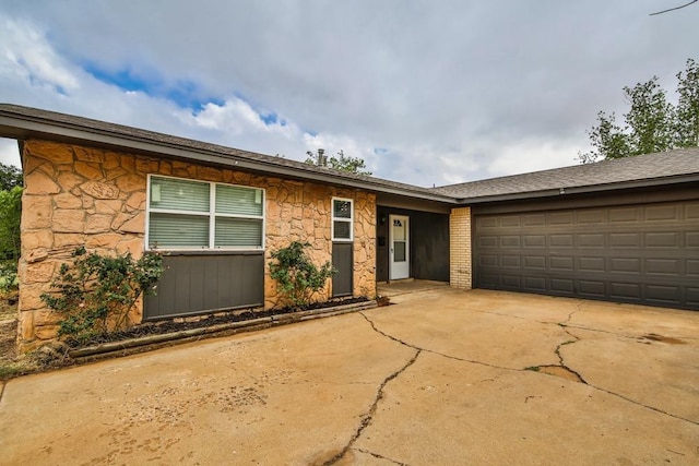 ranch-style house featuring a garage