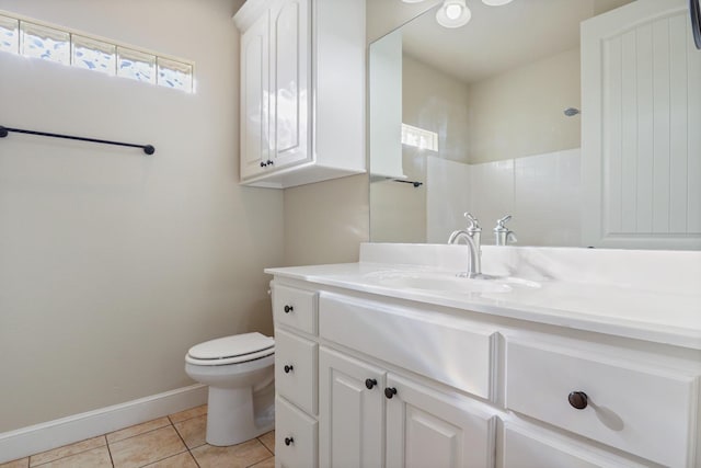 bathroom with walk in shower, tile patterned floors, toilet, and vanity