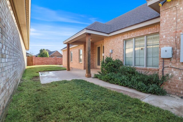 exterior space with a yard and a patio