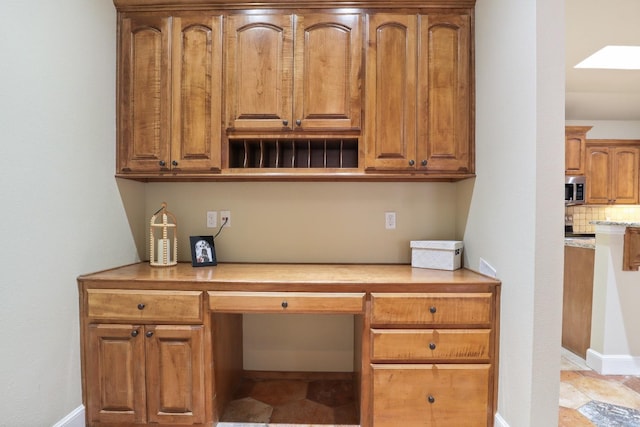 office area featuring built in desk