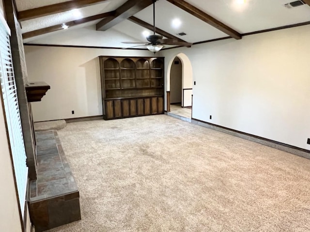 unfurnished living room with carpet floors, lofted ceiling with beams, and ceiling fan