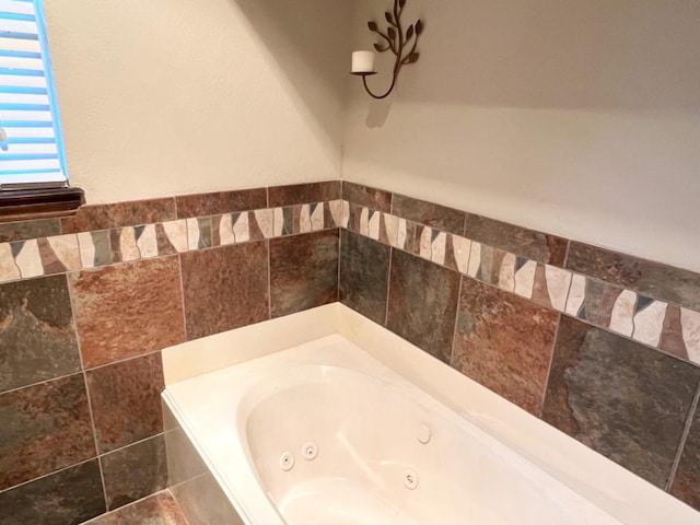 bathroom with a tub to relax in