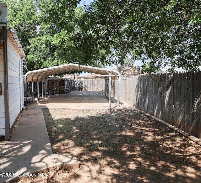 2512 Holliday Dr, Plainview, TX 79072 - view of yard featuring a detached carport