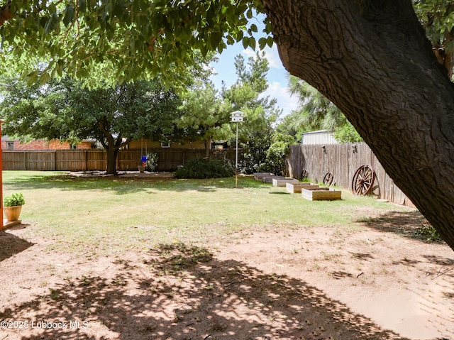 2512 Holliday Dr, Plainview, TX 79072 - view of yard featuring a vegetable garden