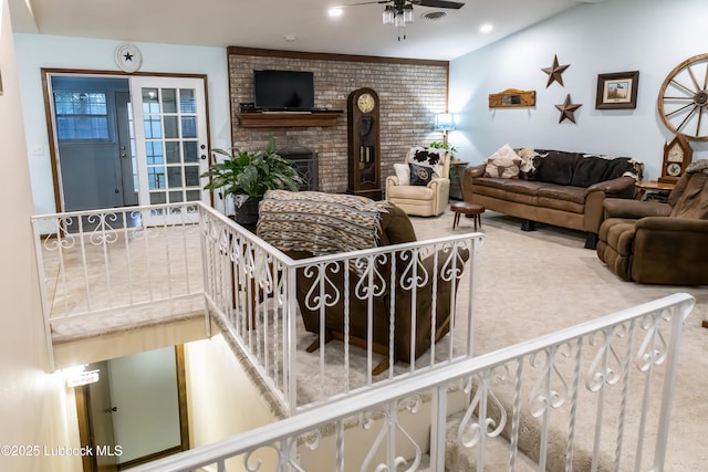 2512 Holliday Dr, Plainview, TX 79072 - living room featuring a ceiling fan, a brick fireplace, brick wall, and recessed lighting
