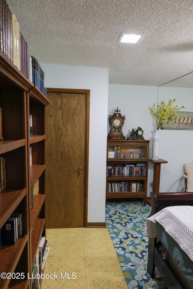 2512 Holliday Dr, Plainview, TX 79072 - bedroom with a textured ceiling and light flooring