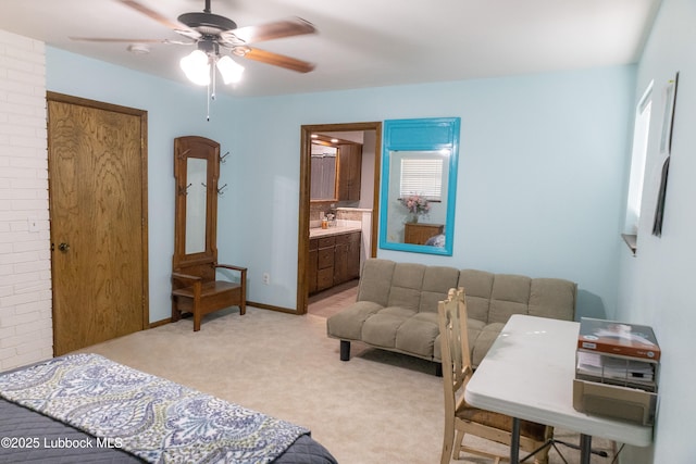 2512 Holliday Dr, Plainview, TX 79072 - bedroom featuring light carpet, ensuite bathroom, a ceiling fan, and baseboards