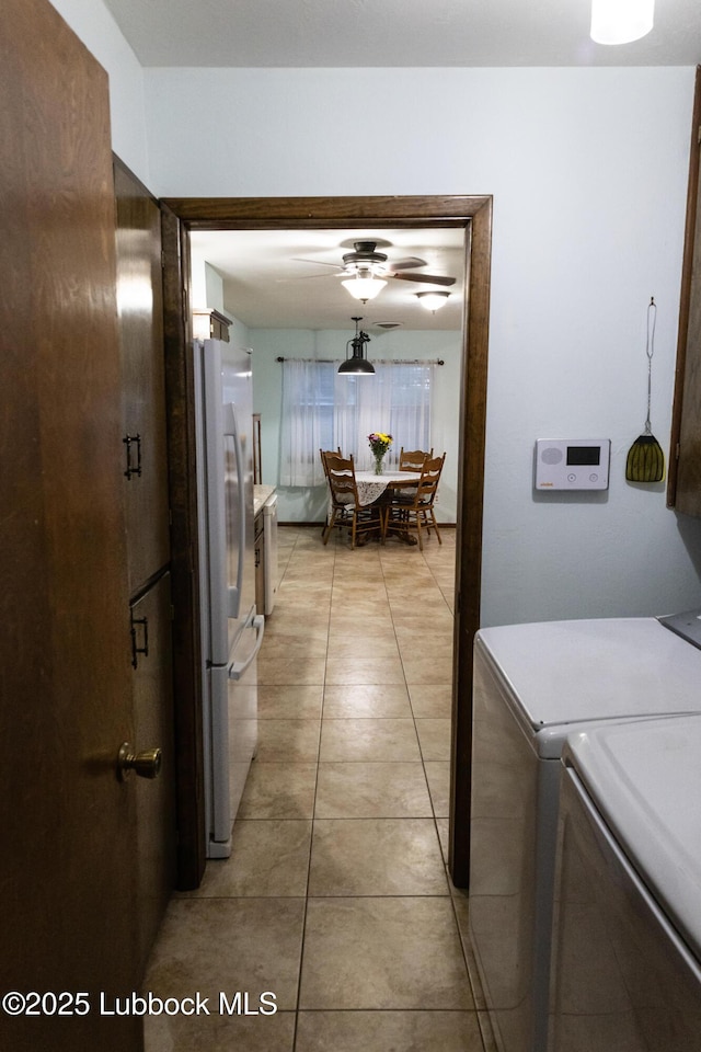2512 Holliday Dr, Plainview, TX 79072 - hall featuring washing machine and dryer and light tile patterned floors