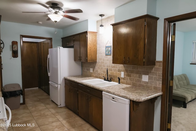 2512 Holliday Dr, Plainview, TX 79072 - kitchen featuring white appliances, a sink, a ceiling fan, and decorative backsplash
