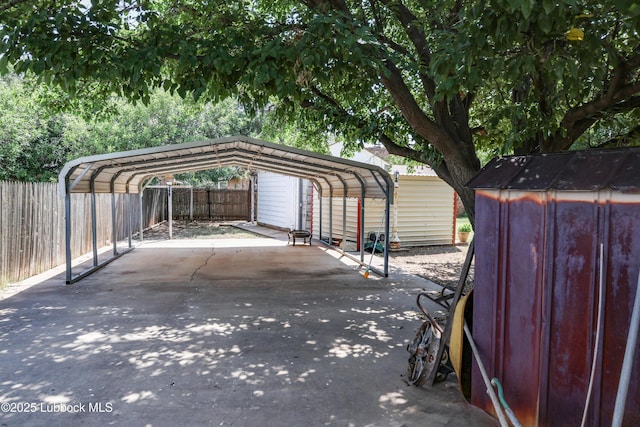 2512 Holliday Dr, Plainview, TX 79072 - view of vehicle parking featuring a detached carport and concrete driveway