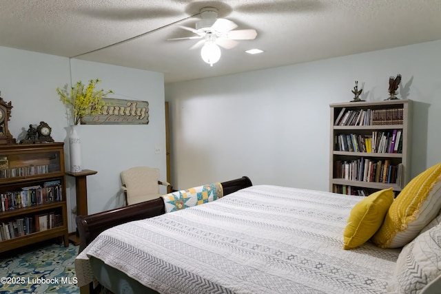2512 Holliday Dr, Plainview, TX 79072 - bedroom featuring a ceiling fan and a textured ceiling