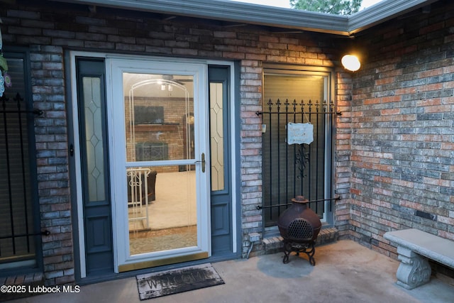 2512 Holliday Dr, Plainview, TX 79072 - doorway to property featuring brick siding