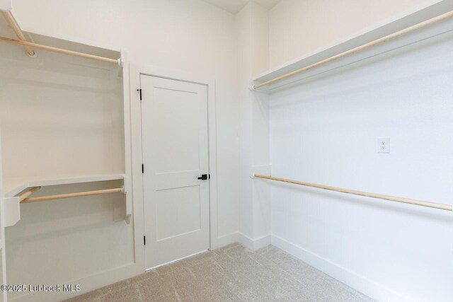 7450 55th St, Lubbock, TX 79407 - spacious closet featuring carpet