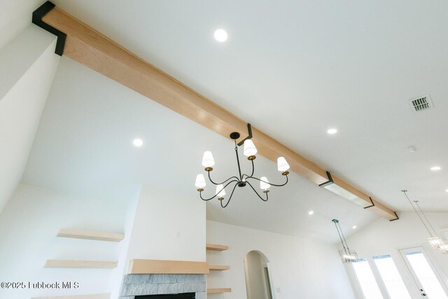 7450 55th St, Lubbock, TX 79407 - detailed view of beamed ceiling, recessed lighting, arched walkways, a fireplace, and a chandelier