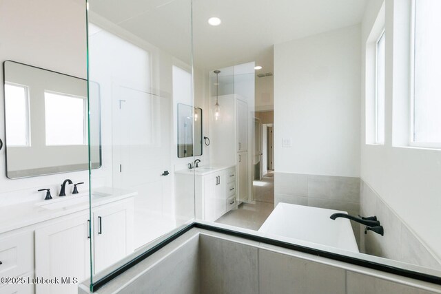 7450 55th St, Lubbock, TX 79407 - full bathroom featuring two vanities