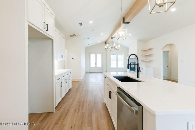 7450 55th St, Lubbock, TX 79407 - kitchen with dishwasher, a sink, arched walkways, vaulted ceiling, and a chandelier