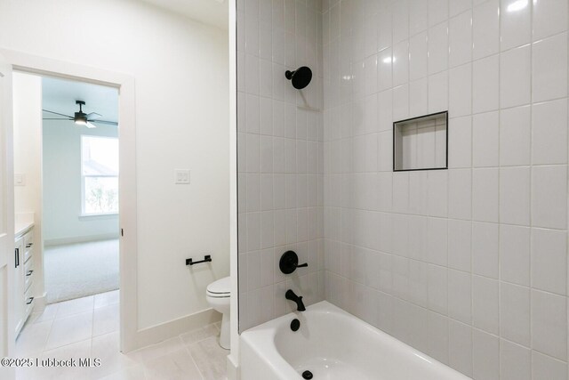 7450 55th St, Lubbock, TX 79407 - full bathroom featuring tile patterned floors, toilet,  shower combination, vanity, and baseboards